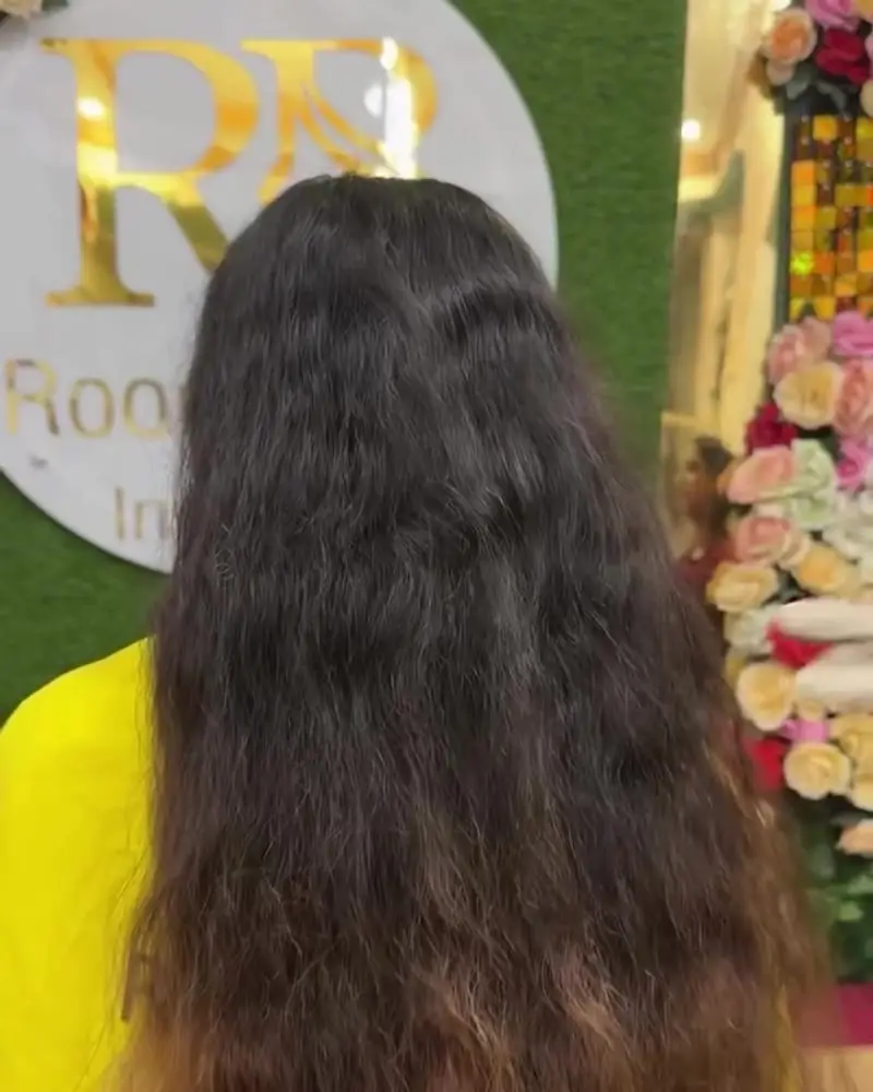 Before: long frizzy, wavy hair seen from behind