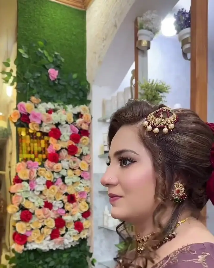 Client with a styled bun and gold hair ornament