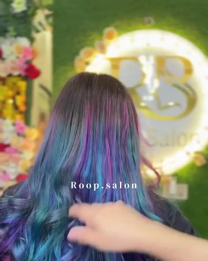 Long hair coloured in blue, purple and teal tones